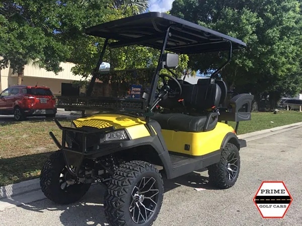 Yellow Aluma 4 Passenger Lifted Golf Cart affordable golf cart rental, golf cart rental san antonio, san antonio golf cart rental golf cart rental